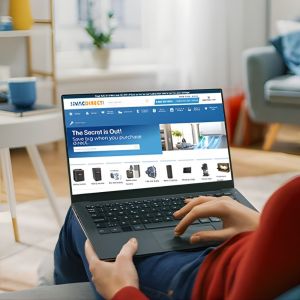 Woman shopping for HVAC systems online at HVACDirect.com using a laptop in a modern living room