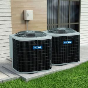 ACiQ central air conditioning condensers installed outside a modern home on concrete pad
