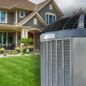 Central air conditioner installed outside a modern suburban house with green lawn and cloudy sky