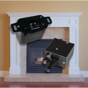 Gas fireplace in a white mantel flanked by a millivolt power module on the left and an electronic ignition control box on the right