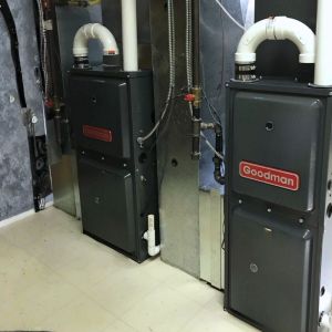 Two Goodman gas furnaces installed side by side for efficient home heating
