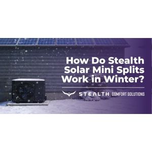 Stealth solar mini split outdoor condenser operating in snowy winter conditions with solar panels on the roof