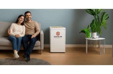 Couple relaxing in a dry, comfortable home with a Santa Fe residential dehumidifier controlling humidity in the living room.