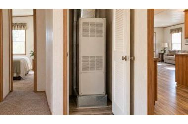 Compact furnace cabinet inside a manufactured-home utility closet