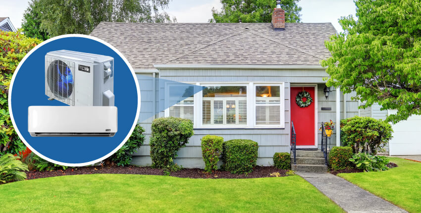 ACiQ ductless mini split system for efficient home heating and cooling Gray home with red front door featuring an ACiQ ductless mini split system illustration showing indoor and outdoor units.