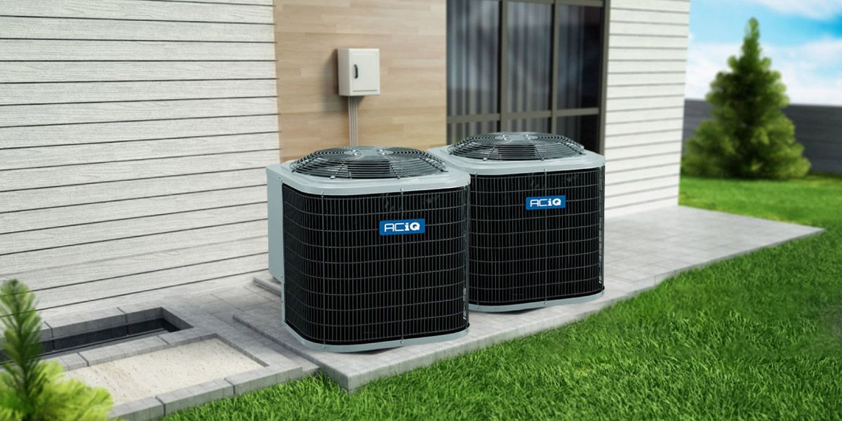 ACiQ Central Air Conditioning Condensers – Durable, Efficient Cooling Systems ACiQ central air conditioning condensers installed outside a modern home on concrete pad