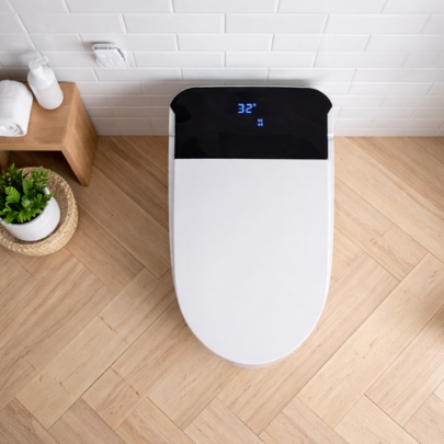 Top view of ACiQ smart toilet showing digital temperature display and sleek lid design