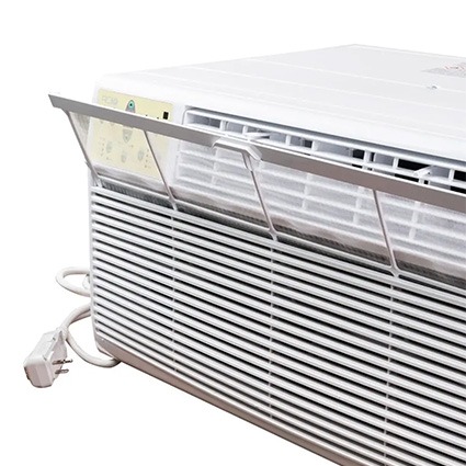 ACiQ mini PTAC air conditioner with the front filter panel open, showing the washable filter and power cord.