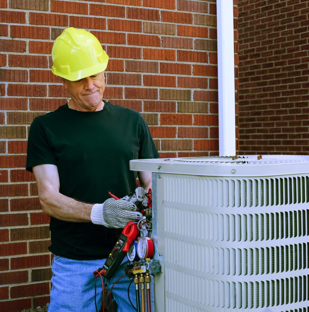 Technician fixing refrigerant