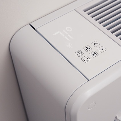 Close-up of a MRCOOL monoblock air conditioner control panel showing the digital temperature display and onboard buttons.