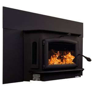 Buck Stove wood fireplace insert with black surround panel and burning logs inside a traditional hearth
