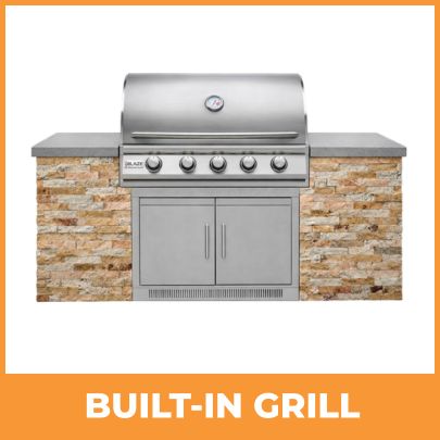Stainless steel built-in gas grill installed into outdoor kitchen island