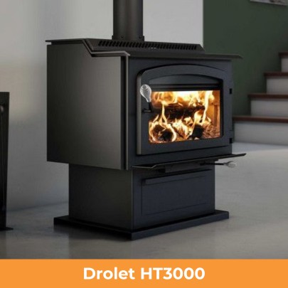 Drolet HT3000 large freestanding wood stove burning fire in modern living space