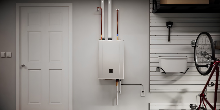 Noritz EZ Series Pro tankless water heater mounted on a garage wall