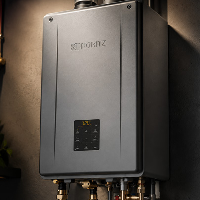 Close-up of the Noritz NRCB combination boiler front panel showing the digital temperature display and control buttons